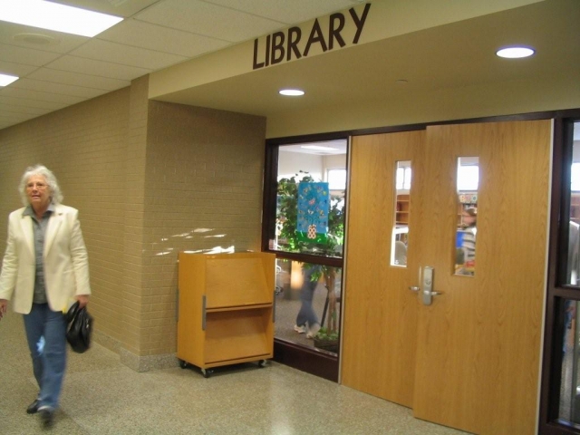 The former wrestling gym, near the back entrance, is now a library.
