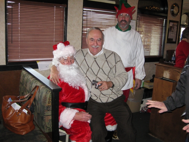Bill Drake 58 gives Santa his Christmas list.