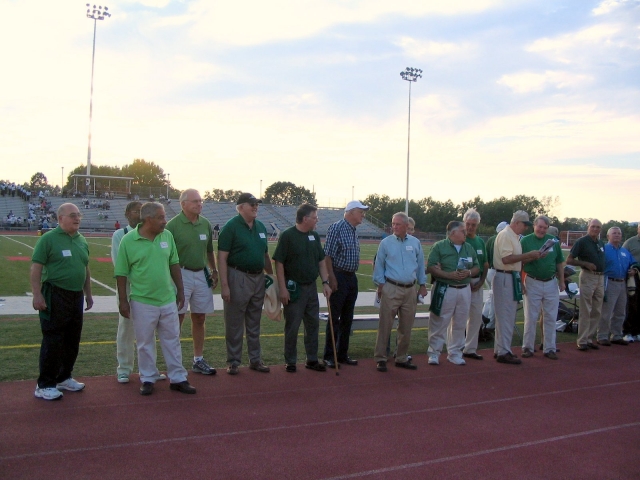 The 58 team members were called onto the field before the start of the Hall of Fame game.