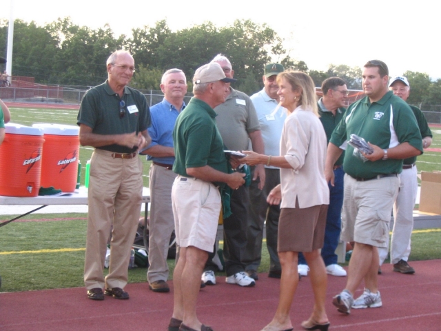 CDHS Principal Carol John and CDHS Athletic Director John Shaffer presented plaques to each player.