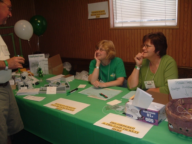 The registration table is manned by Wendy Chronister Cooper 72 and Vickie Cassel Devaney 70