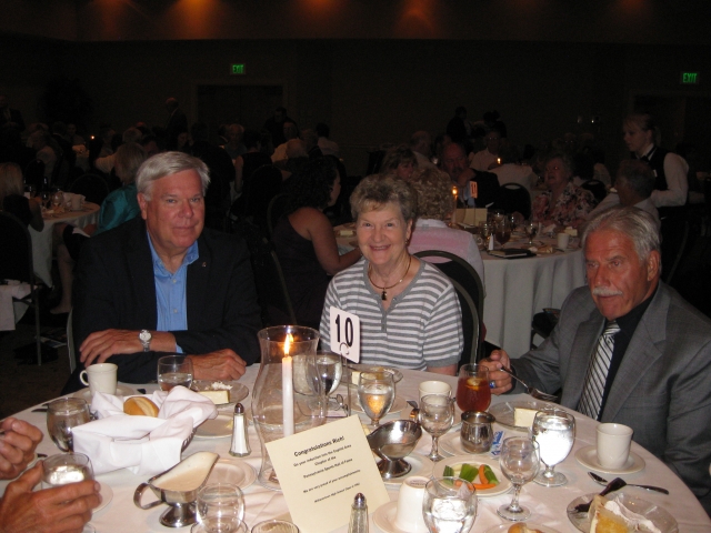 CD School Board President & former football coach Ford Thompson, wife Nancy Thompson, and former coach Bill Herigan.